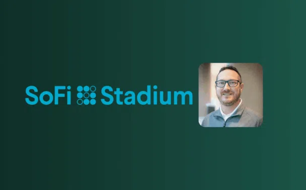 SoFi Stadium logo in blue on a dark green background, with a small photo of a smiling man wearing glasses and a collared shirt on the right.