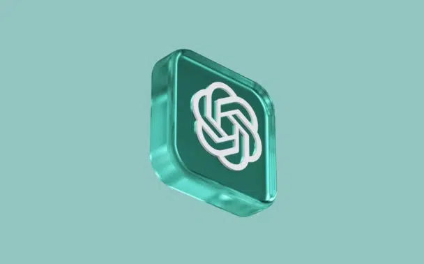 A 3D teal square with rounded corners features a white abstract knot design in the center, resembling the OpenAI logo, set against a plain teal background.