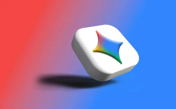 A 3D white hexagonal object with a multicolored star-like symbol floats above a gradient red-to-blue background, casting a soft shadow.